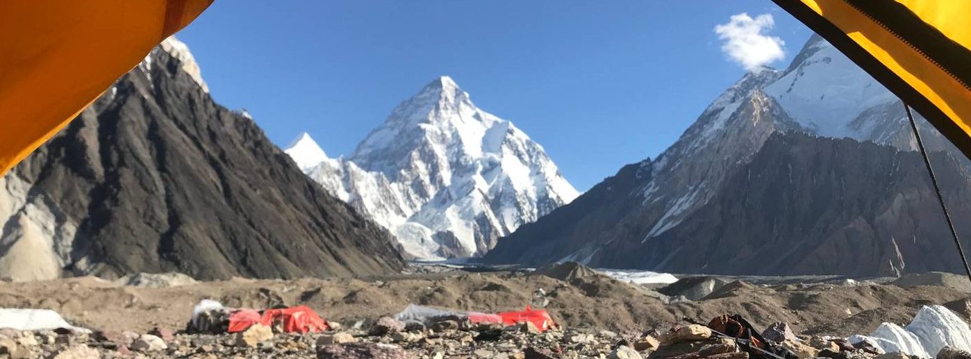 A panoramic view of the towering peaks and glaciers along the Baltoro Glacier, including K2, Broad Peak, and Gasherbrums, during the Machulo La Trek expedition.
