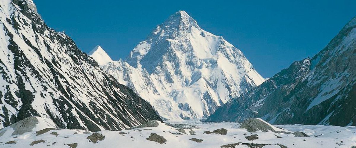 Ghandoghoro Peak, Hushe Valley, Gilgit-Baltistan, mountain expedition, trekking, alpine landscape, snow-capped peaks, adventure, Himalayas, northern Pakistan, mountaineering, scenic view, rugged terrain, outdoor adventure, traditional village