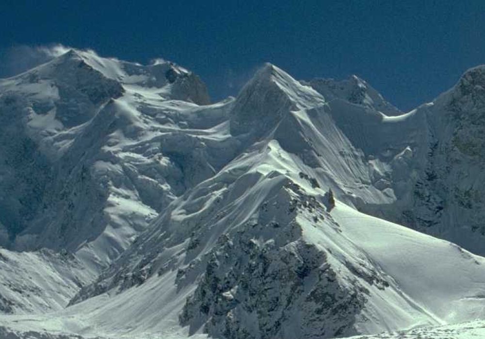 Hispar Peak, Hispar Valley, Gilgit-Baltistan, mountain expedition, high-altitude climbing, glacier terrain, snow-capped mountains, adventure tourism, rugged landscape, northern Pakistan, mountaineering, alpine scenery, exploration, outdoor adventure