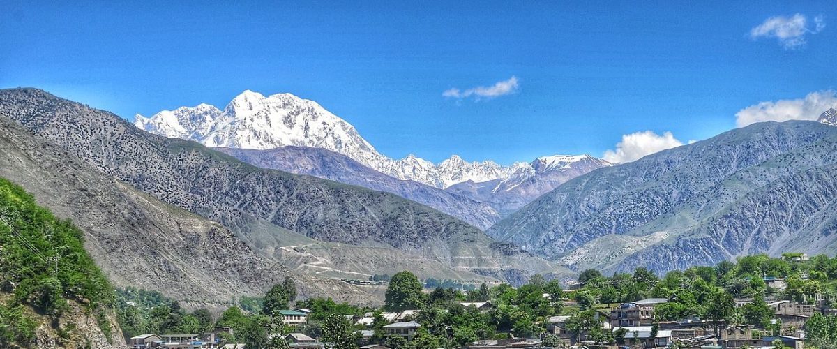 Ghandoghoro Peak, Hushe Valley, Gilgit-Baltistan, mountain expedition, trekking, alpine landscape, snow-capped peaks, adventure, Himalayas, northern Pakistan, mountaineering, scenic view, rugged terrain, outdoor adventure, traditional village