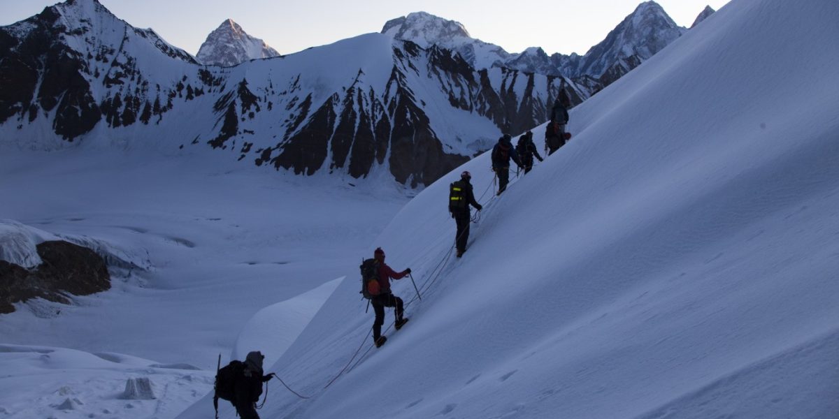 gondogor-la-trek-k2-basecamp A panoramic view of the towering peaks and glaciers along the Baltoro Glacier, including K2, Broad Peak, and Gasherbrums, during the Machulo La Trek expedition.
