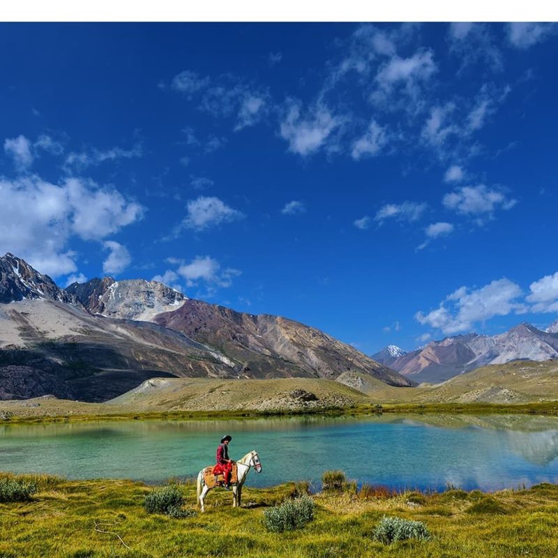 Trekker enjoying horse riding at shah jinali pass trek