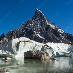 mitre peak Mitre Peak towering over the confluence of Baltoro and Godwin-Austen Glaciers near Concordia."