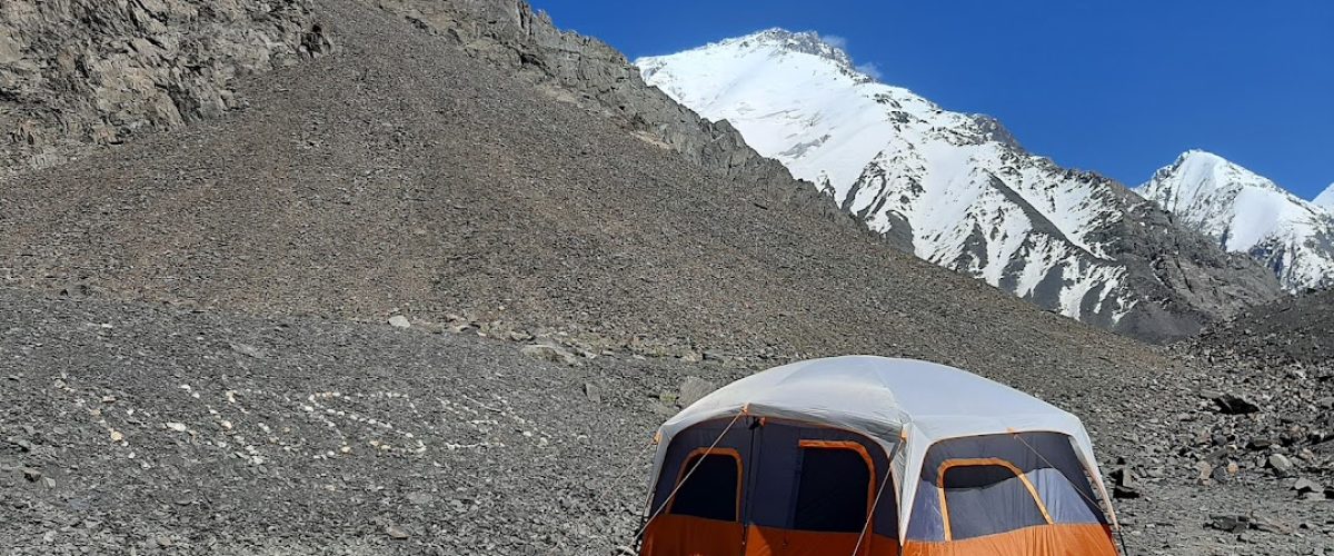 Ghandoghoro Peak, Hushe Valley, Gilgit-Baltistan, mountain expedition, trekking, alpine landscape, snow-capped peaks, adventure, Himalayas, northern Pakistan, mountaineering, scenic view, rugged terrain, outdoor adventure, traditional village