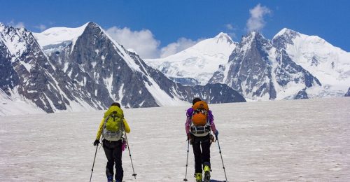 Two women skiing on the Biafo glacier in the Karakoram himalaya in Pakistan